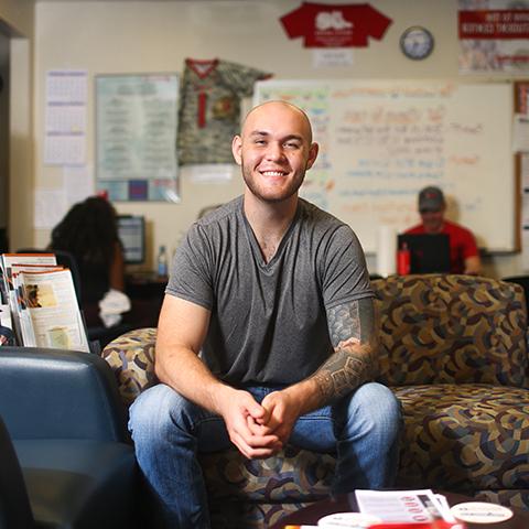 Mental health counseling student sits in Newton Military Family Resource Center